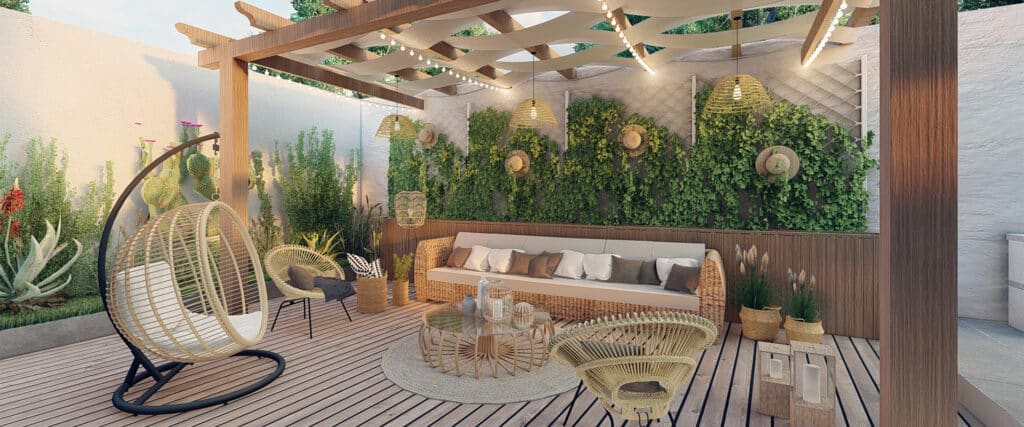 Patio bohème avec deck bois, pergola, mur végétal et mobilier en rotin: canapé, fauteuils, table basse. Lumières douces créent ambiance détente.